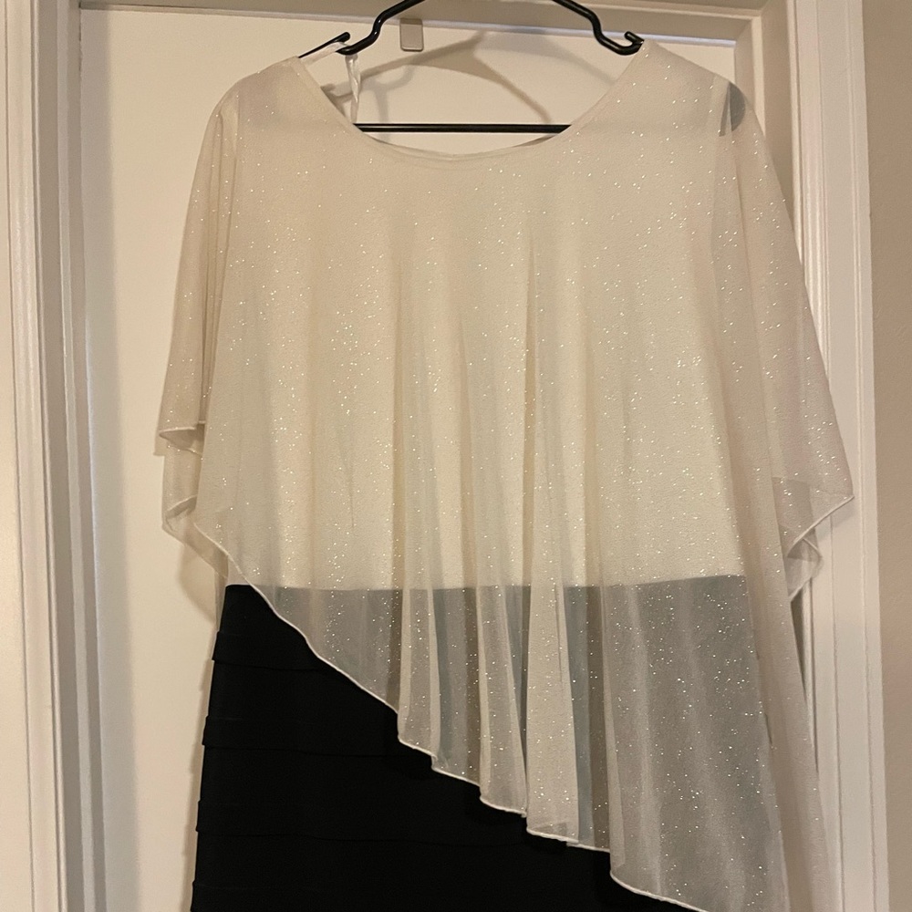Knee length dress. Black bottom top is cream with gold specks
